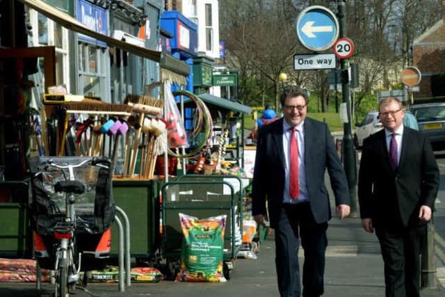 Then High Streets Minister Marcus Jones (right) walks with Councillor Johnny Hayes during his time as chairman of the Bishopthorpe Road Traders Association, down Bishopthorpe Road in York in March 2016 after the road had been named Britain's Best High Street. Picture by Gary Longbottom.