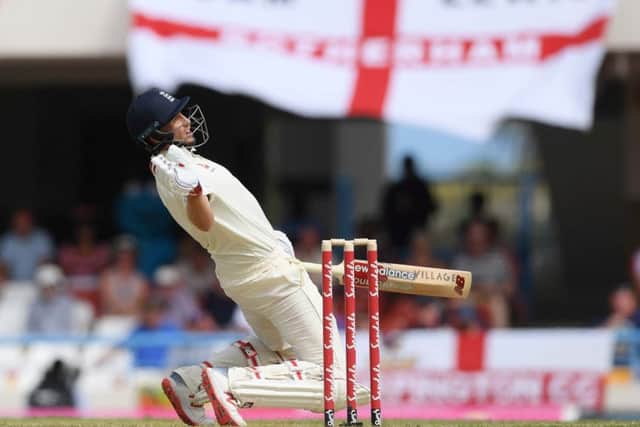 GONER: Captain Joe Root is caught out for seven by Shai Hope. Picture: Shaun Botterill/Getty Images