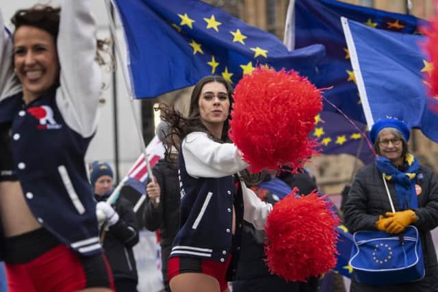 Cheerleaders performing at brexit protests outside Parliament.