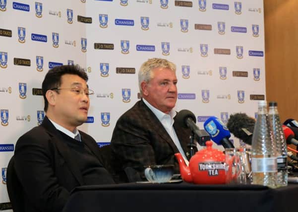 FRESH CHALLENGE: New Sheffield Wednesday manager Steve Bruce with chairman Dejphon Chansiri, left. Picture: Chris Etchells