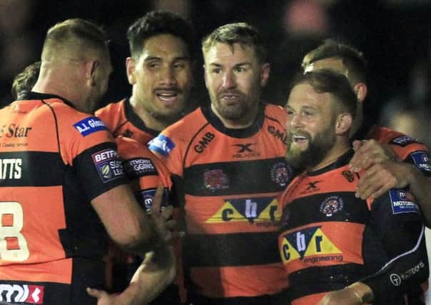 Paul McShane celebrates his try against Catalans Dragons with his Castleford Tigers team-mates.