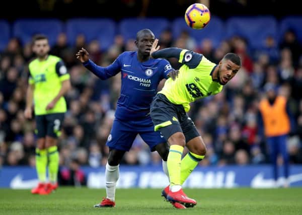 Chelsea's N'Golo Kante (left) and Huddersfield Town's Elias Kachunga battle for the ball.