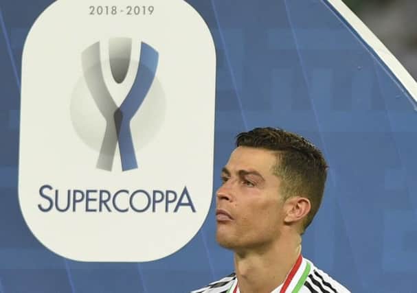 Global game: Juventus' Cristiano Ronaldo at the end of the Italian Super Cup final against AC Milan at King Abdullah stadium in Jiddah, Saudi Arabia.