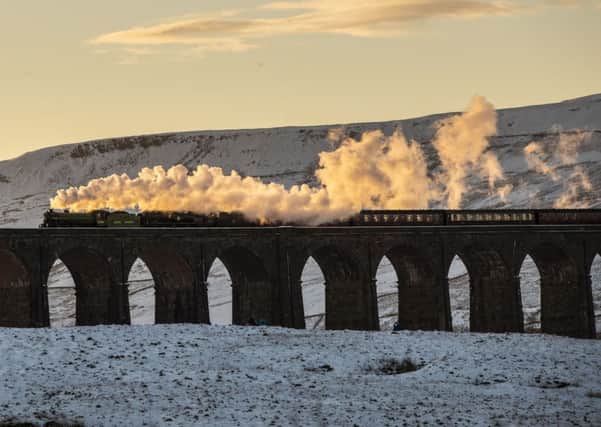 The Winter Cumbrian Mountain Express  61306 and 35018 crosses the Ribblehead Viaduct. Photo: Danny Lawson/PA Wire.