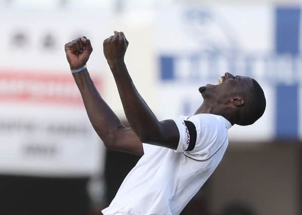 West Indies' captain Jason Holder celebrates the dismissal of England's James Anderson as the Windies closed in on victory  but Holder will be banned for the third Test.