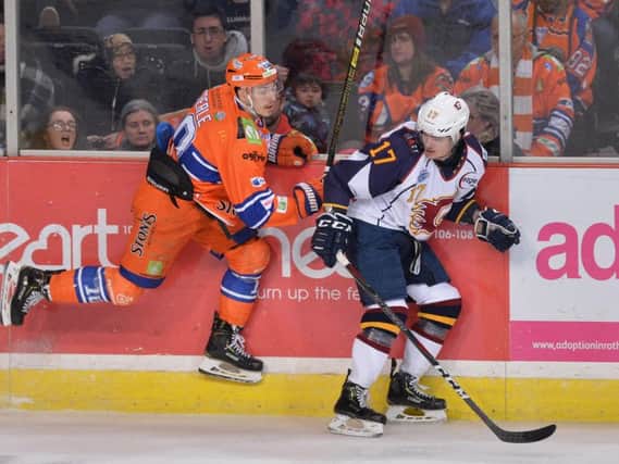Tanner Eberle puts pressure on Guildford's TJ Foster. Picture: Dean Woolley.