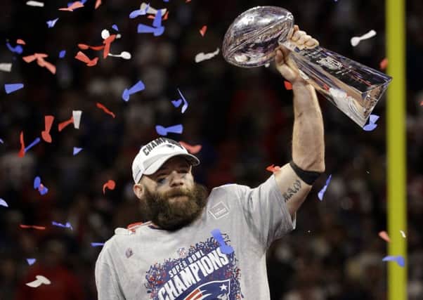 Julian Edelman lifts the Lombardi Trophy after winning Super Bowl LIII with New England Patriots (Picture: Mark Humphrey/AP).