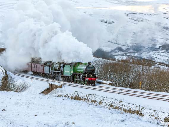 The Winter Cumbrian Mountain Express crosses the snowy Dales