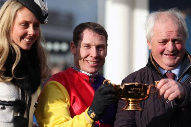 Champion jockey Richard Johnson and his wife Fiona celebrate Native River's Gold Cup win with trainer ColinTizzard (right).