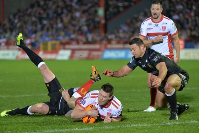 Joel Tomkins slides in for Hull KR's first try against Hull FC at Craven Park.  Picture: Bruce Rollinson