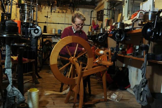 Joyce Chadwick spinning wool in the sock making area. Picture Tony Johnson.