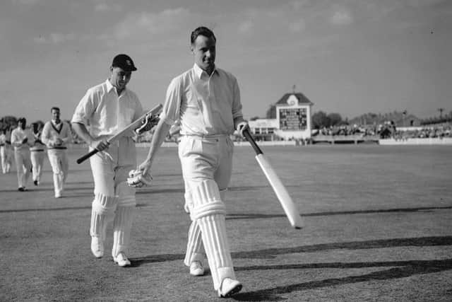 LEGENDS: Peter May, right, and Colin Cowdrey leave the field at Edgbaston after a record partnership of 411 runs against the West Indies in 1957.  Picture: Central Press/Getty Images.