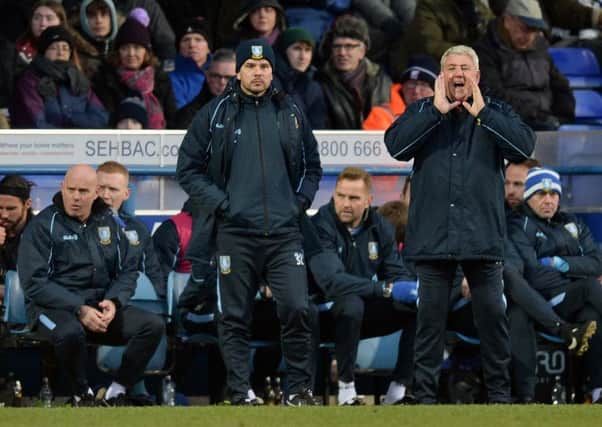 Sheffield Wednesday manager Steve Bruce, seen alongside one of his assistants Stephen Clemence, bellows instructions at Portman Road on Saturday (Picture: Steve Ellis).