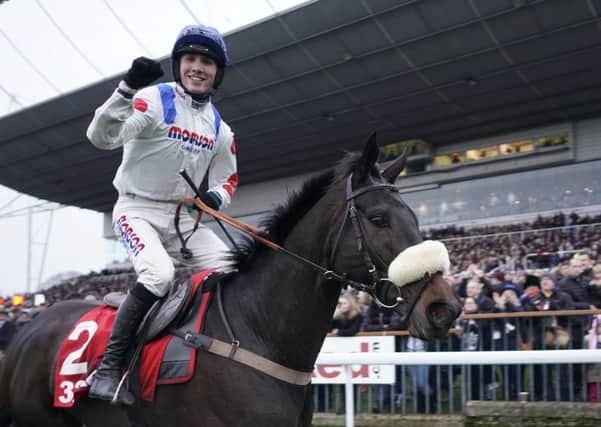 Harry Cobden celebrates his King George VI Chase win on Clan Des Obeaux who is due to line up at Newbury this weekend.