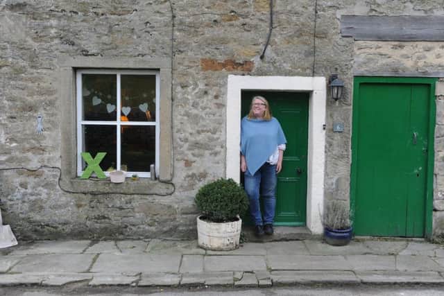 Helen outside her cottage in a hamlet near Appletreewick in the Yorkshire Dales.