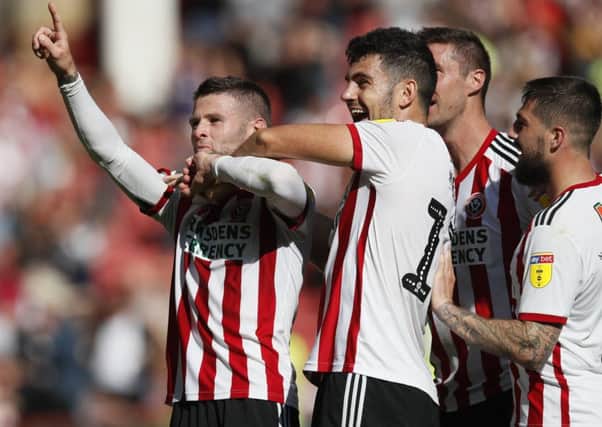 On the up: Oliver Norwood, left, celebrates scoring for Sheffield United in their impreesive victory over Aston Villa at Bramall Lane back in September. (Picture: Simon Bellis/Sportimage)