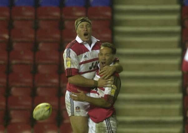 GOOD OLD DAYS: .
Adrian Lam celebrates a try with Dave Furner.  Picture: Nick Fairhurst.
