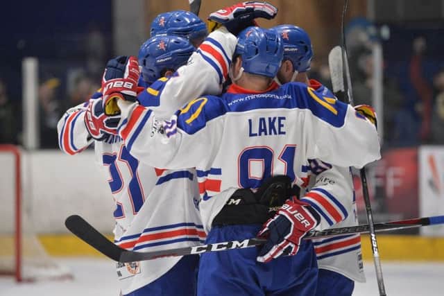 GB's players celebrate one of their three goals against Dinamo Riga on Wednesday in Coventry. Picture: Dean Woolley.