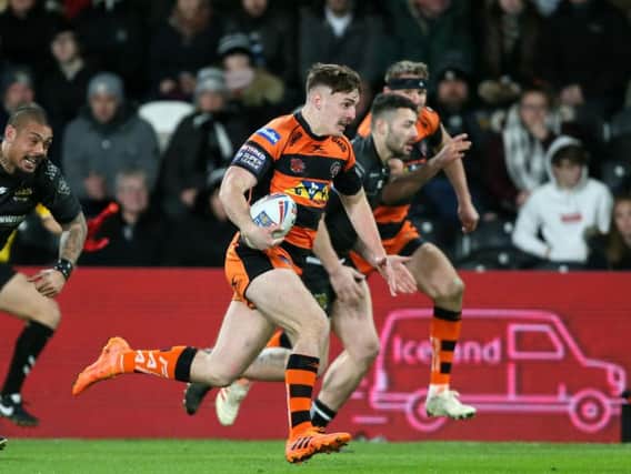 Castleford's Jake Trueman breaks clear of the Hull FC defence. (Richard Sellers/PA Wire)