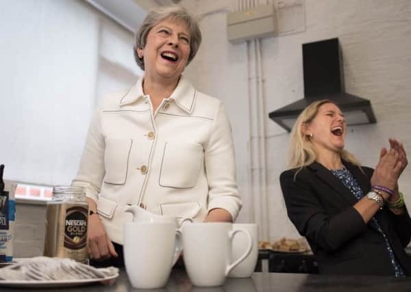 Theresa May at a loneliness campaign event with Kim Leadbeater, sister of murdered MP Jo Cox.