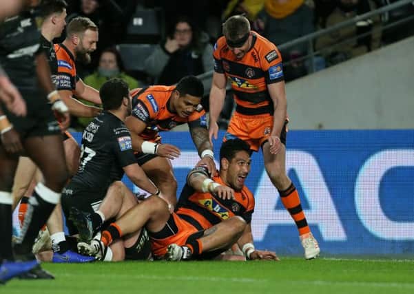 Castleford Tiger's Jesse Sene-Lefao (floor) celebrates scoring his sides second try at Hull. Picture: Richard Sellers/PA