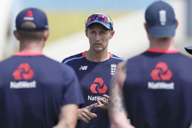 England's captain Joe Root speaks to his team-mates during a training session at the Darren Sammy Cricket Ground in Gross Islet, St. Lucia, on Friday (Picture: Ricardo Mazalan/AP).