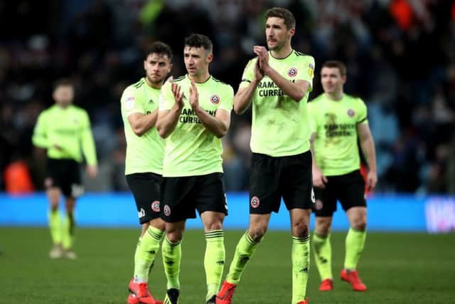 Sheffield United's Chris Basham applauds the travelling fans after the Blades had lost a three-goal lead to draw 3-3 with Aston Villa on Friday night (Picture: Nick Potts/PA Wire).