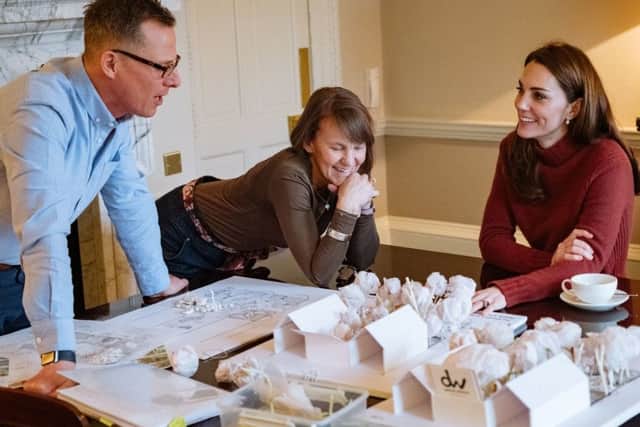 The Duchess of Cambridge with Andree Davies (centre) and Adam White (left), of Davies White Landscape Architect, discussing plans for her "Back To Nature" garden.  PIC: Kensington Palace/PA Wire