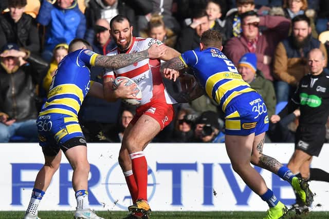 Hull KR's Kane Linnentt makes an early attack against Warrington. (PIC: Dave Howarth/PA Wire)