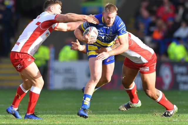 Warrington's Mike Cooper tries to evade Hull KR's Robbie Mulhern and Mose Masoe. (PIC: Dave Howarth/PA Wire)