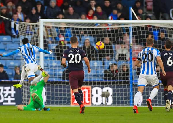 Whose goal?: Arsenal's Sead Kolasinac is credited with an own goal but Huddersfield's Karlan Grant claims he got the last touch.