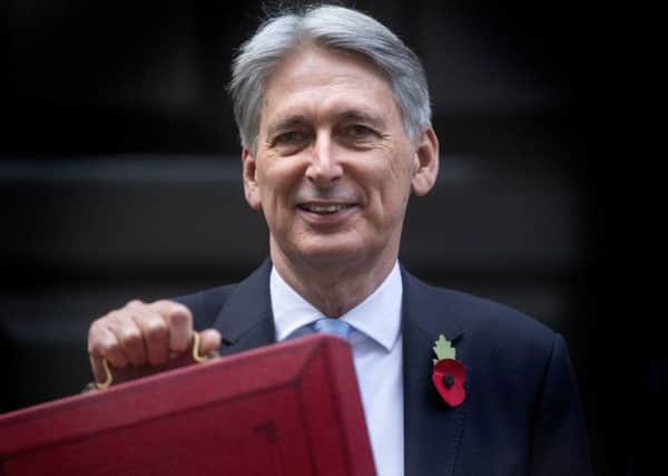 A think tank has said Chancellor Philip Hammond will have to find billions of pounds of extar Government spending if he is to live up to Theresa May's pledge to end austerity. Photo: Victoria Jones/PA Wire