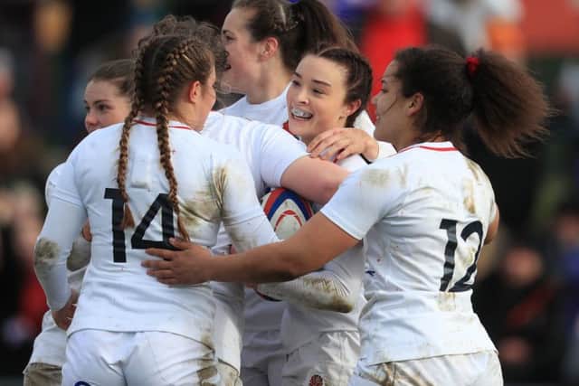 England's women celebrate after Kelly Smith's try against France at Doncaster.
