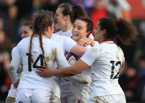 England's women celebrate after Kelly Smith's try against France at Doncaster.