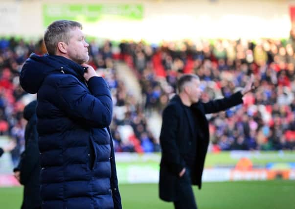 Doncaster Rovers' manager Grant McCann, left, with Peterborough and former Rovers boss Darren Ferguson (Picture: Marie Caley).