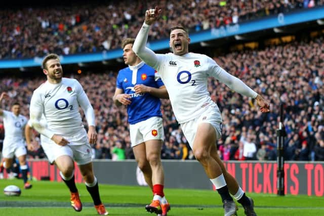 England's Jonny May celebrates scoring is team's first try of the game at Twickenham. Picture: Gareth Fuller/PA