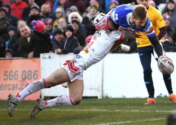Wakefield's Tom Johnstone scores his first try against Saints.