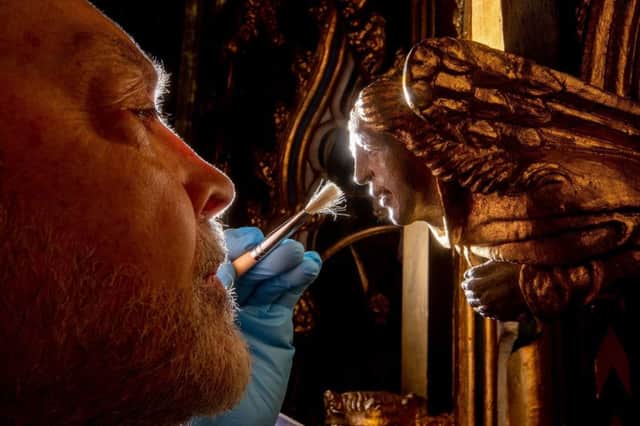 Francis Downing works on the Lady Chapel reredos created in 1905 as the Minster's memorial to Queen Victoria. Picture: Charlotte Graham