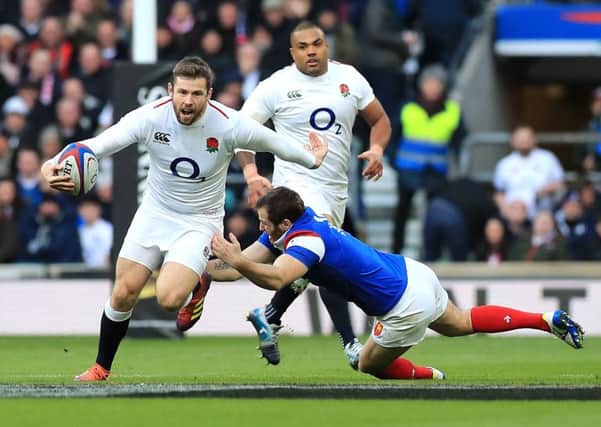 England's Elliot Daly (left) in action during the Guinness Six Nations match at Twickenham Stadium, London. (Picture: Gareth Fuller/PA Wire)