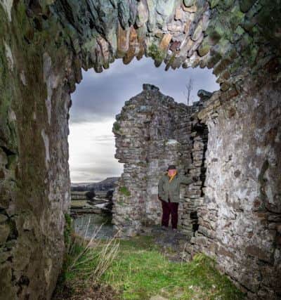 Date:18th January 2019.
Picture James Hardisty.
YP Magazine......Pendragon Castle a Grade I Anient Monument, situated four miles south of Kirkby Stephen in the Mallerstang dale. Pictured 
A view looking out of the bedroom of Lady Anne Clifford, Countess of Pembroke, Dorest and Montgomery, a well-preserved room on the first floor with a vaulted ceiling a window to the west and an area of orginal plaster, along with John Bucknall, 69, owner of Pendragon Castle admiring remains of his castle.