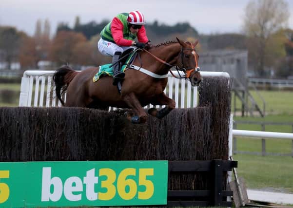 Danny Cook and Definitly Red clear the last in Wetherby's Charlie Hall Chase last November.