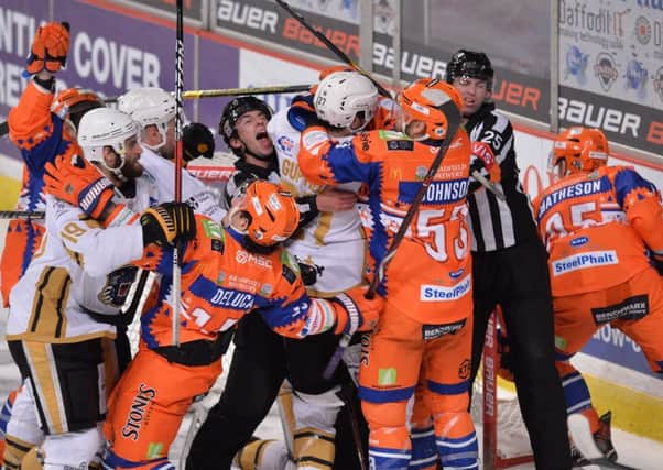CALM DOWN, CALM DOWN: Steelers and Panthers players get to grips with each other during their Sheffield Arena encounter on December 27. The hosts won 5-3. Picture: Dean Woolley.