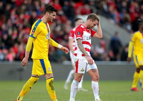Doncaster Rovers' James Coppinger (right) shows his frustration during the FA Cup defeat to Crystal Palace at the Keepmoat Stadium. Picture: Richard Sellers/PA