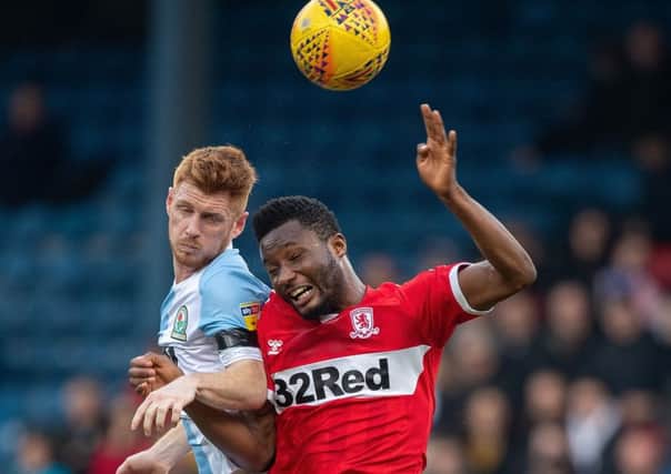 Middlesbroughs John Obi Mikel jumps for the ball with  Blackburn Rovers Harrison Reed (Picture: Ian Hodgson/PA Wire).