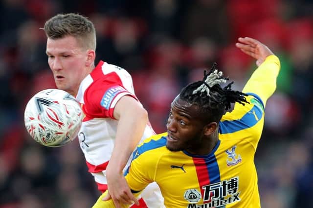 Doncaster Rovers Paul Downing challenges Crystal Palaces Michy Batshuayi during Sunday's FA Cup fifth-round tie (Picture: Richard Sellers/PA Wire).