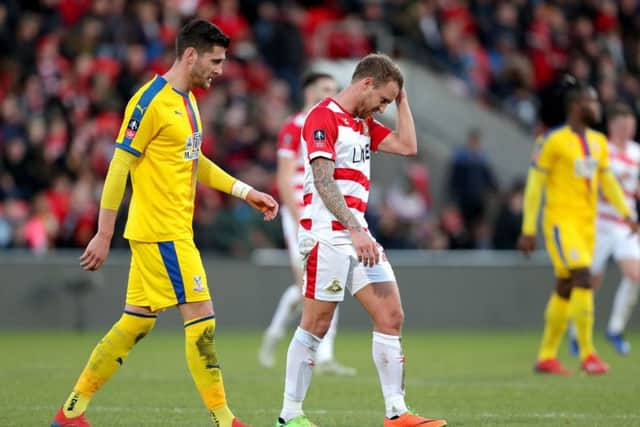 Dismayed Doncaster Rovers stalwart James Coppinger heads for the dressing room at half-time after Crystal Palace had just scored their second goal (Picture: Richard Sellers/PA Wire).