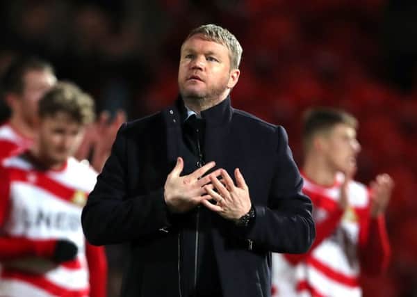 Doncaster Rovers manager Grant McCann acknowledges the crowd after the FA Cup defeat to Crystal Palace at the Keepmoat Stadium. Picture: Richard Sellers/PA