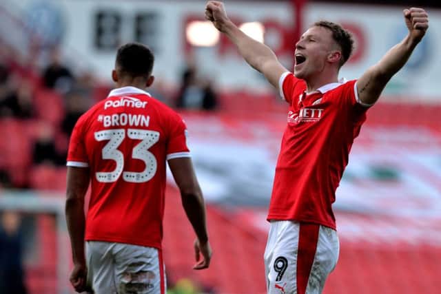 Hero: Cauley Woodrow celebrates scoring Barnsley's second goal against Wycombe Wanderers. Picture: Bruce Rollinson