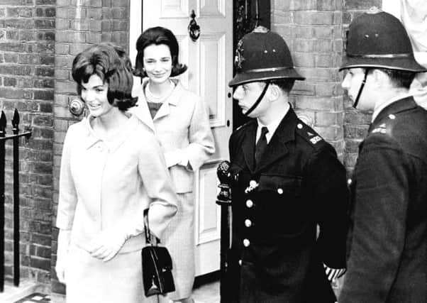 Jacqueline Kennedy is followed by her sister, Lee Radziwill, in London in 1961.
