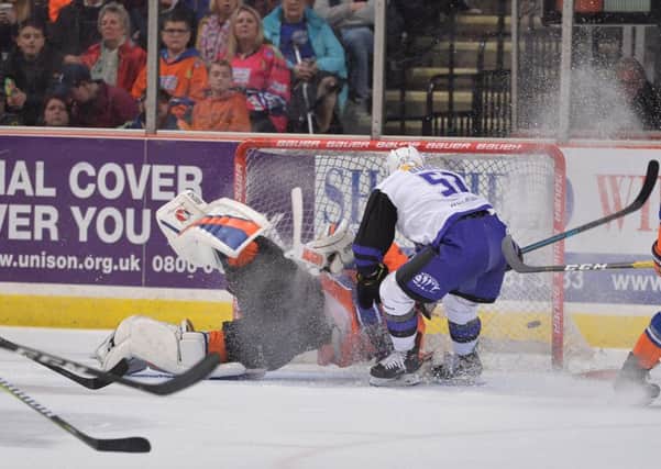 Guillaume Doucet scores past Sheffield Steelers' Jackson Whistle with a simple tap-in for his second goal of the night and Glasgow's fifth (Picture: Dean Woolley).